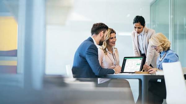 Startup team successfully navigating complex HR challenges with outsourced support, leading to accelerated growth and success.